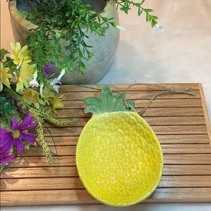 Pineapple trinket dish with decorative twine.